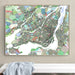 Colorful map of Montreal on a wall above a white surface.