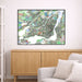 Framed map of Montreal on a wall above a wooden cabinet and sofa.