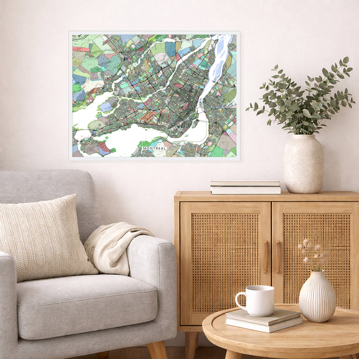 Living room with a city map on the wall, a couch, and a side table with a plant and books.