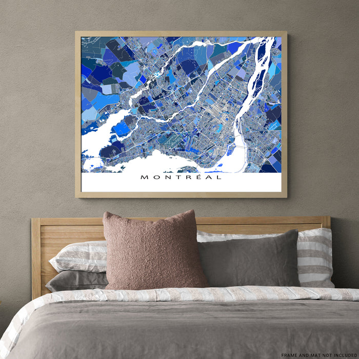 Framed map of Montreal above a bed with pillows and bedding.