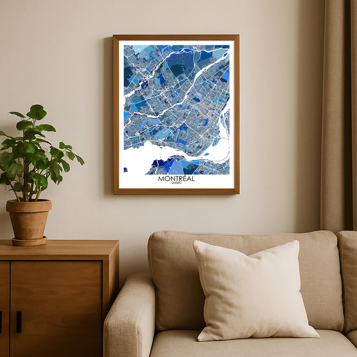 Framed map of Montreal on a wall above a beige sofa with a plant beside it.