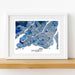 Framed map of Montreal on a wooden surface with a white background