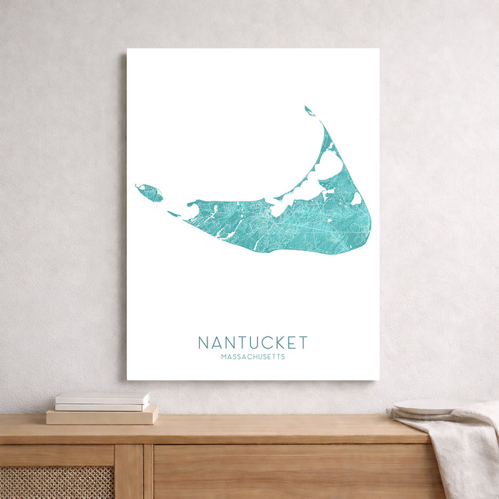 Map of Nantucket, Massachusetts on a white background, displayed on a wall above a wooden shelf.