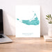 Nantucket Massachusetts map print on a desk with a laptop and plant.