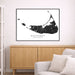 Framed map of Nantucket on a wall above a wooden cabinet and sofa.