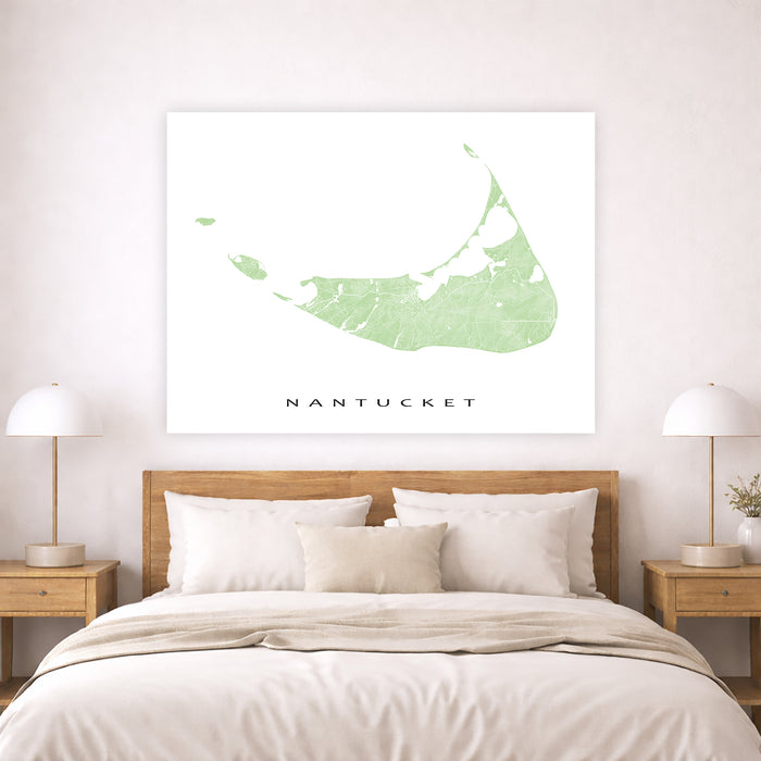 Map of Nantucket on a wall above a bed in a bedroom setting