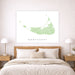 Map of Nantucket on a wall above a bed in a bedroom setting