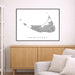 Framed map of Nantucket on a wall above a wooden cabinet and sofa.