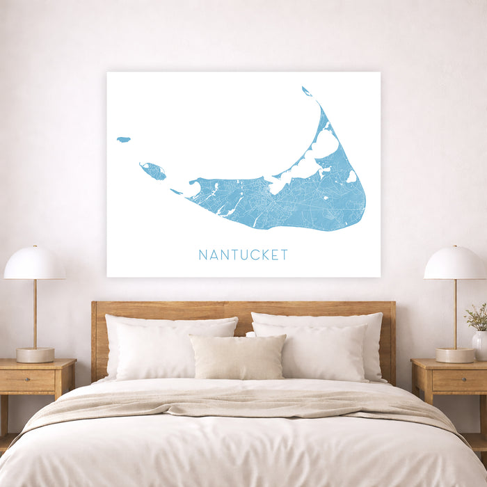 Bedroom with a map of Nantucket on the wall above a bed.