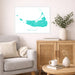 Living room with a gray sofa, wooden cabinet, and Nantucket map print on the wall.
