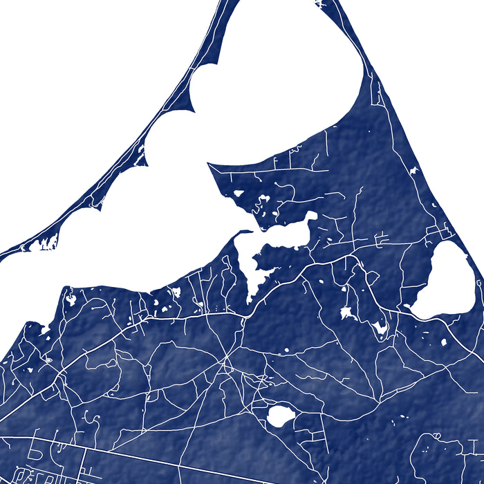 Map of a coastal area with roads and water bodies in white on a blue background