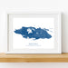 Framed map of Nassau, New Providence, The Bahamas on a white wall.