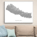 Framed map of Nepal on a wall above a sofa