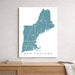 Map of New England on a white wall above a wooden surface