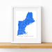 Framed map of New England on a white wall
