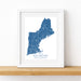 Framed map of New England on a white wall