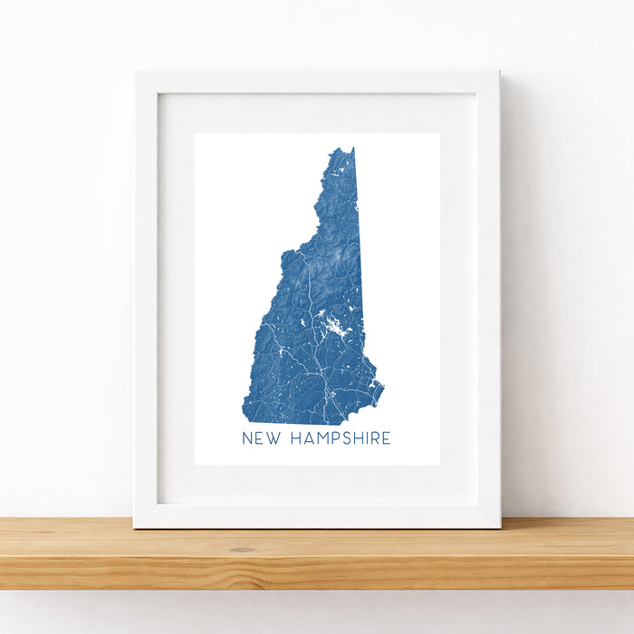 Framed map of New Hampshire on a white wall
