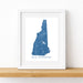 Framed map of New Hampshire on a white wall