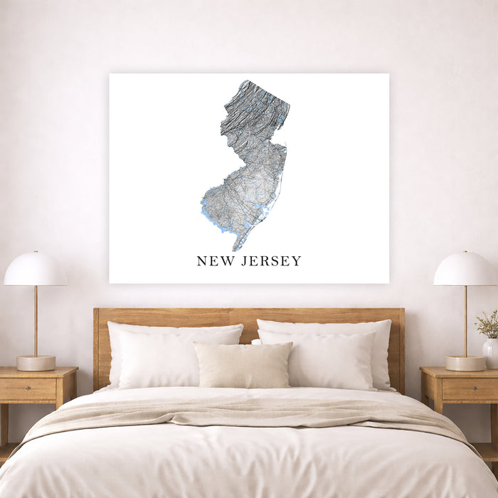 Map of New Jersey on a wall above a bed in a bedroom setting