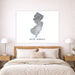 Map of New Jersey on a wall above a bed in a bedroom setting