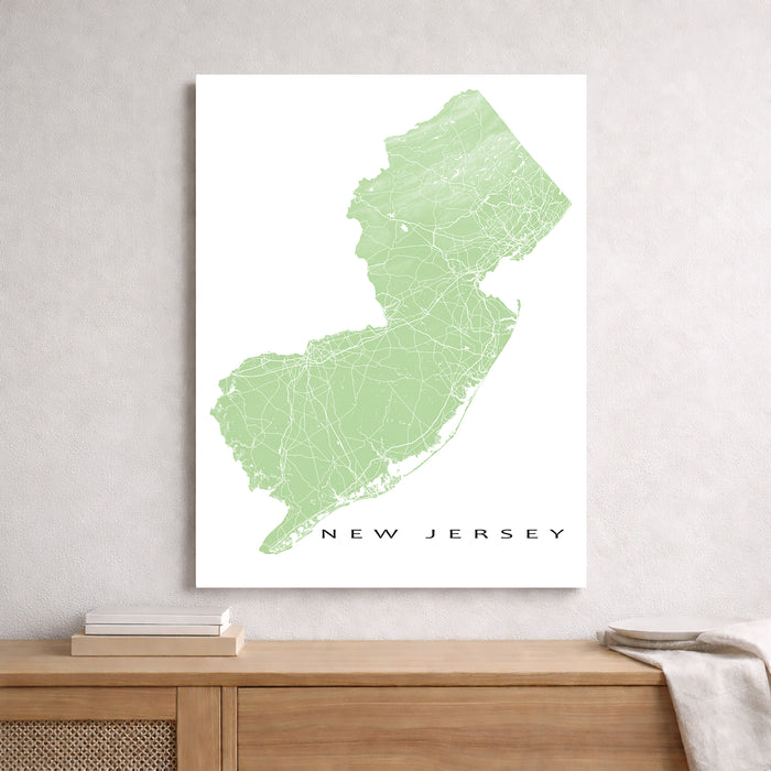 Map of New Jersey on a white background above a wooden surface.