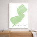 Map of New Jersey on a white background above a wooden surface.