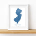 Framed map of New Jersey on a white wall