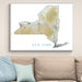 Framed map of New York on a wall above a beige sofa with light blue pillows.