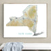 Framed map of New York on a wall above a white surface with a gray towel.