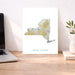 Map of New York on a desk with a laptop and plant