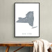 Framed map of New York on a wall above a wooden bench.