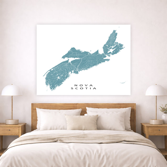 Map of Nova Scotia on a wall above a bed in a bedroom