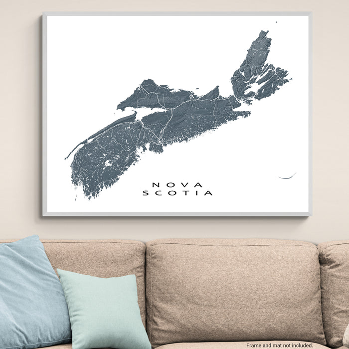 Framed map of Nova Scotia on a wall above a beige sofa with light blue pillows.