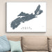 Framed map of Nova Scotia on a wall above a beige sofa with light blue pillows.