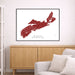 Map of Nova Scotia framed on a wall above a wooden cabinet and sofa.