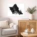 Framed map of Oahu on a wall above a sofa in a living room.