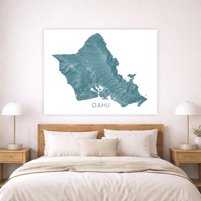 Map of Oahu on a wall above a bed in a bedroom setting
