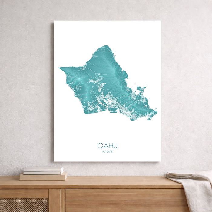 Framed map of Oahu, Hawaii on a wall above a wooden shelf.