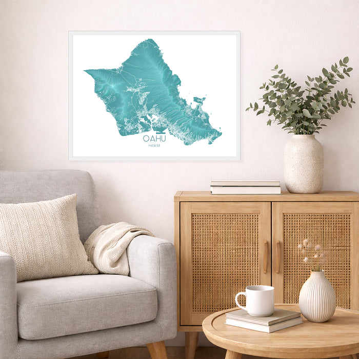Living room with a map of Oahu on the wall, a vase with plants, and a coffee table with books and a mug.