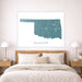 Map of Oklahoma on a wall above a bed in a bedroom setting