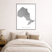 Map of Ontario framed on a wall above a bed in a bedroom.
