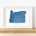 Framed map of Oregon on a white wall