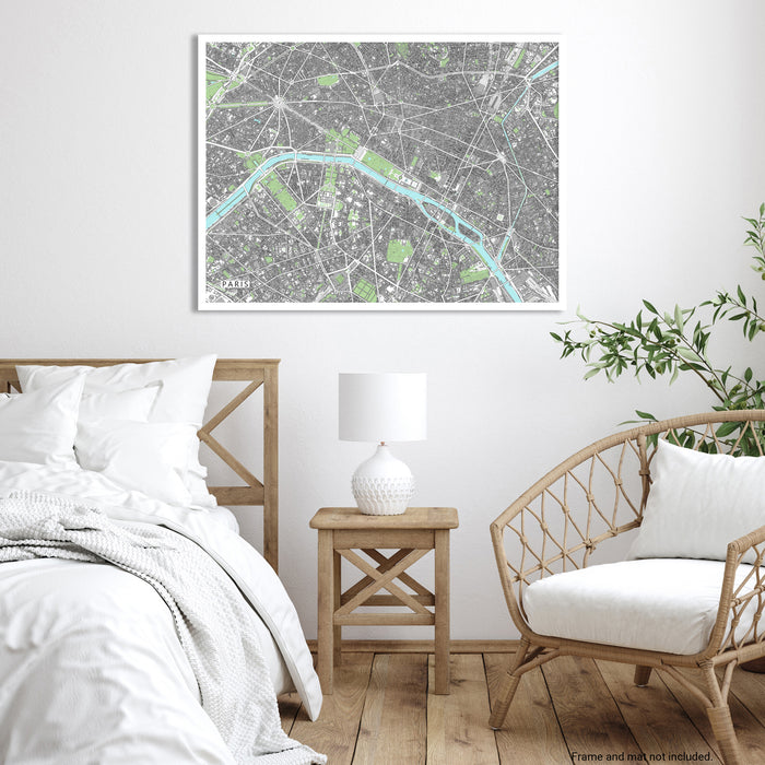 Bedroom with a map poster on the wall, wooden bed, side table, and chair.