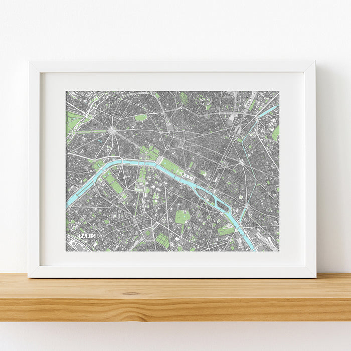 Framed city map print on a wooden shelf