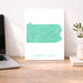 Map of Pennsylvania on a white background next to a laptop on a wooden desk.