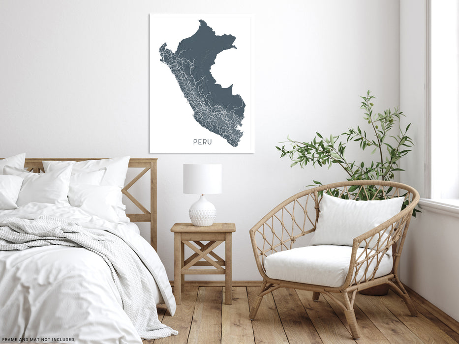 Modern bedroom with a bed, chair, and wall art of Peru