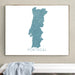 Framed map of Portugal on a wall above a white bench.