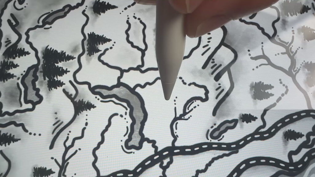 Hand drawing a tree on a Maps As Art Vancouver Island illustrated map