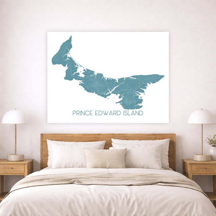 Map of Prince Edward Island on a wall above a bed in a bedroom.