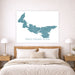 Map of Prince Edward Island on a wall above a bed in a bedroom.